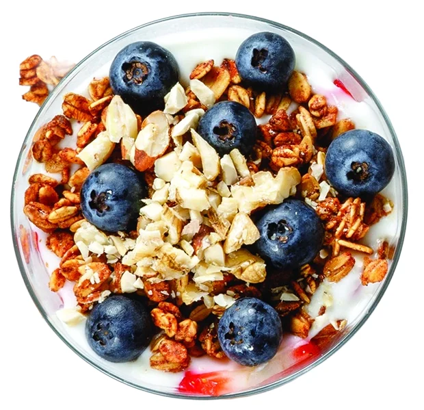 Yogurt bowl with granola, almonds and blueberries