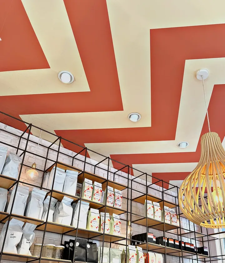 The striped ceiling over the shelving